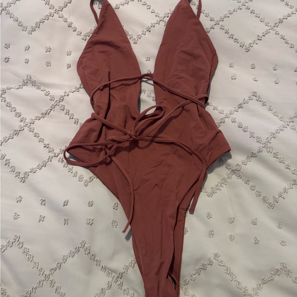 Never worn wrap around one piece swimsuit.